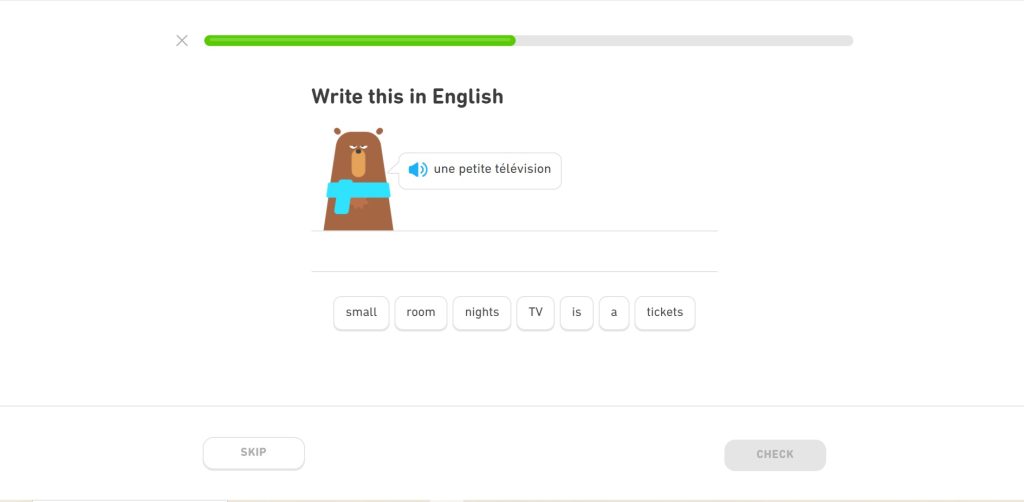 A snobbish looking brown bear wearing a blue scarf around his neck stands beside an exercise that asks users to translate the phrase "une petite télévision" into English by choosing from an assortment of words.