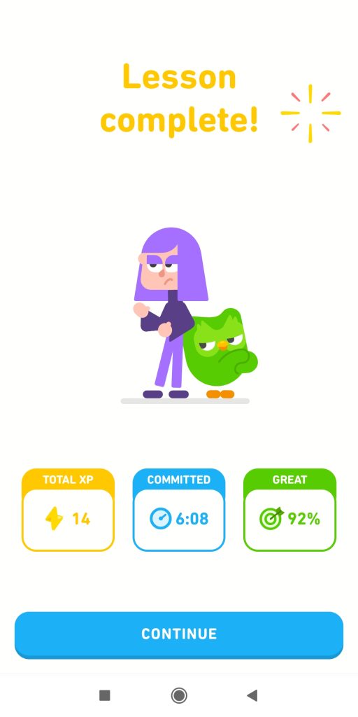 Lesson complete page showing score and other info. Duolingo mascot Duo the Owl and Goth teenager Lily stand back to back striking triumphant poses, although Lily continues to look a bit cynical.