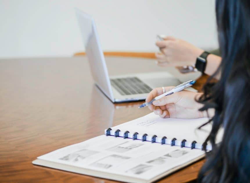 woman writing in notebook